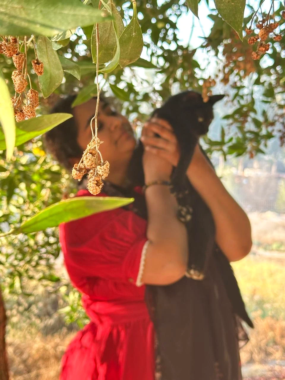 Aysha holding a black cat
